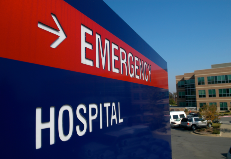 emergency room sign red and blue with white text