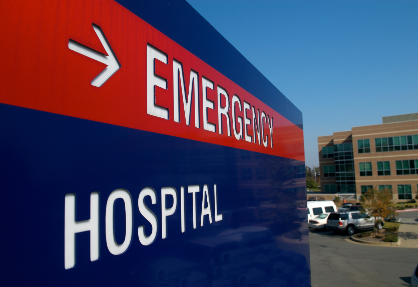 emergency room sign red and blue with white text