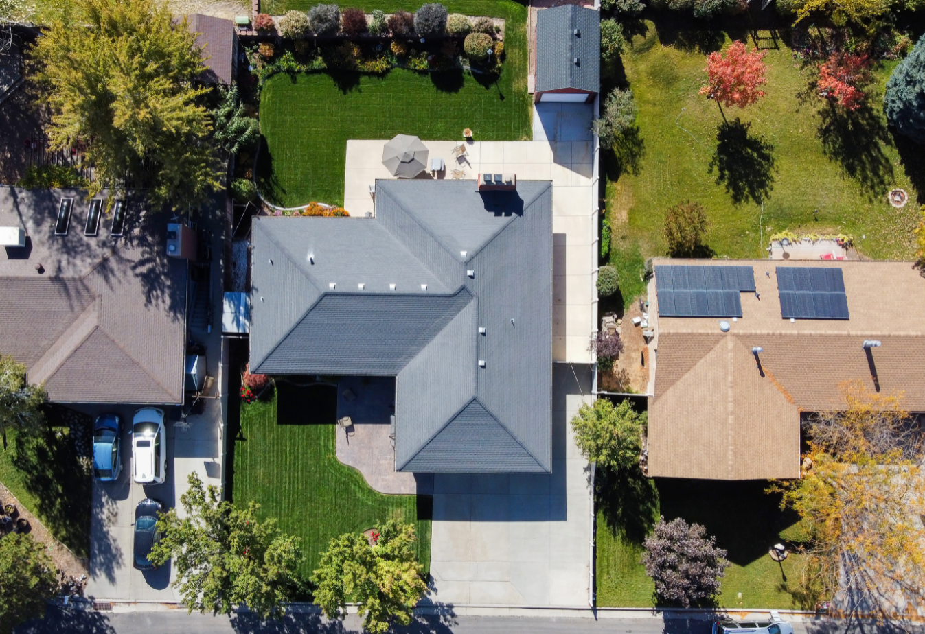 aerial view of a subdivision, three homes