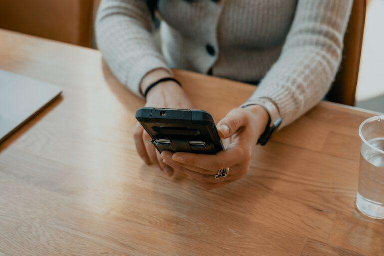 picture of someone's hands holding a cell phone image for ATDS blog post